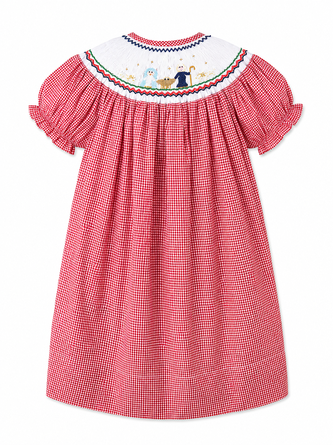 A girl's bishop red and white gingham dress shown from the back, featuring a white smocked yoke with colorful smocked nativity scene and a red, blue, and green border.