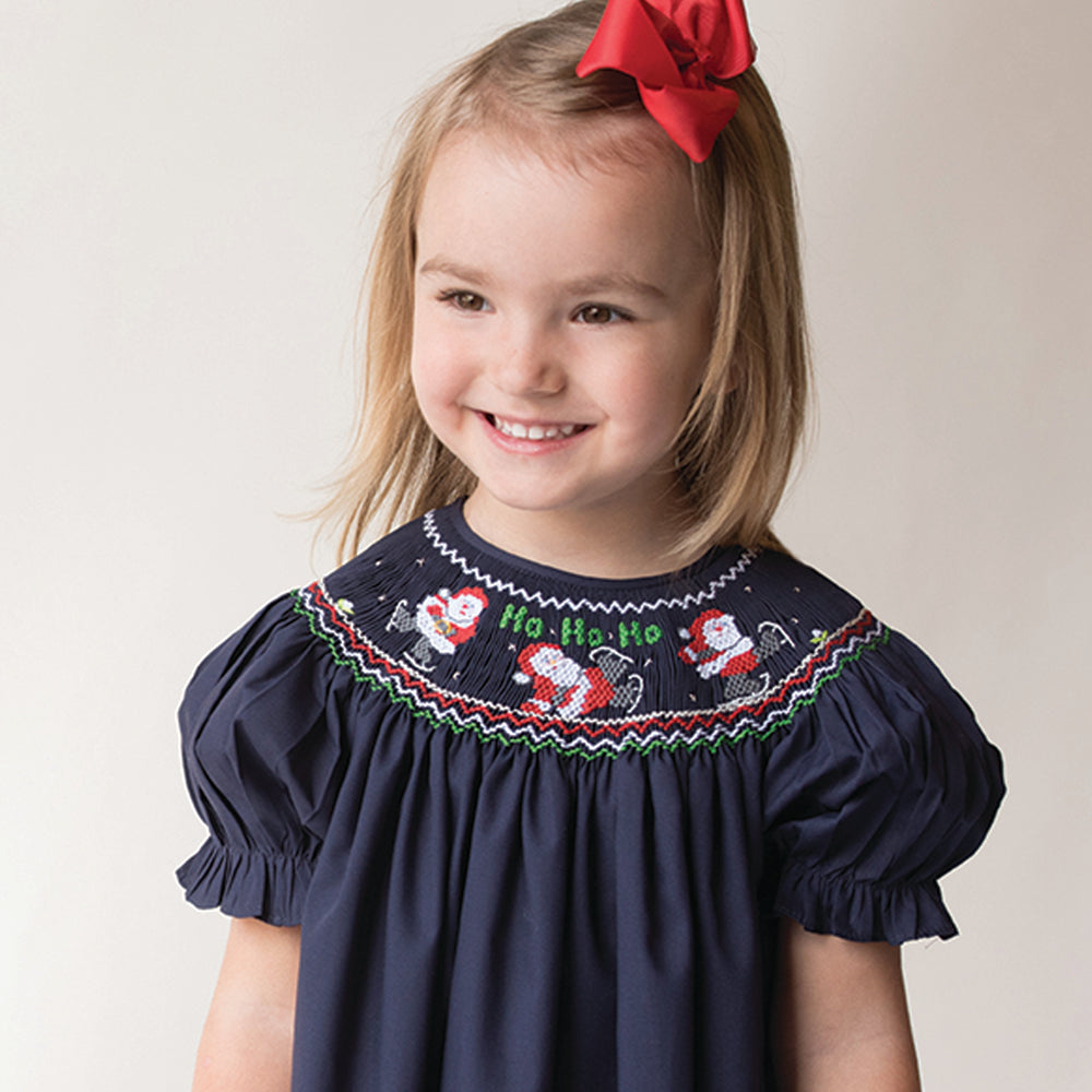 HO HO HO Skating Santas Navy Blue Smocked Bishop 17H 6093 A