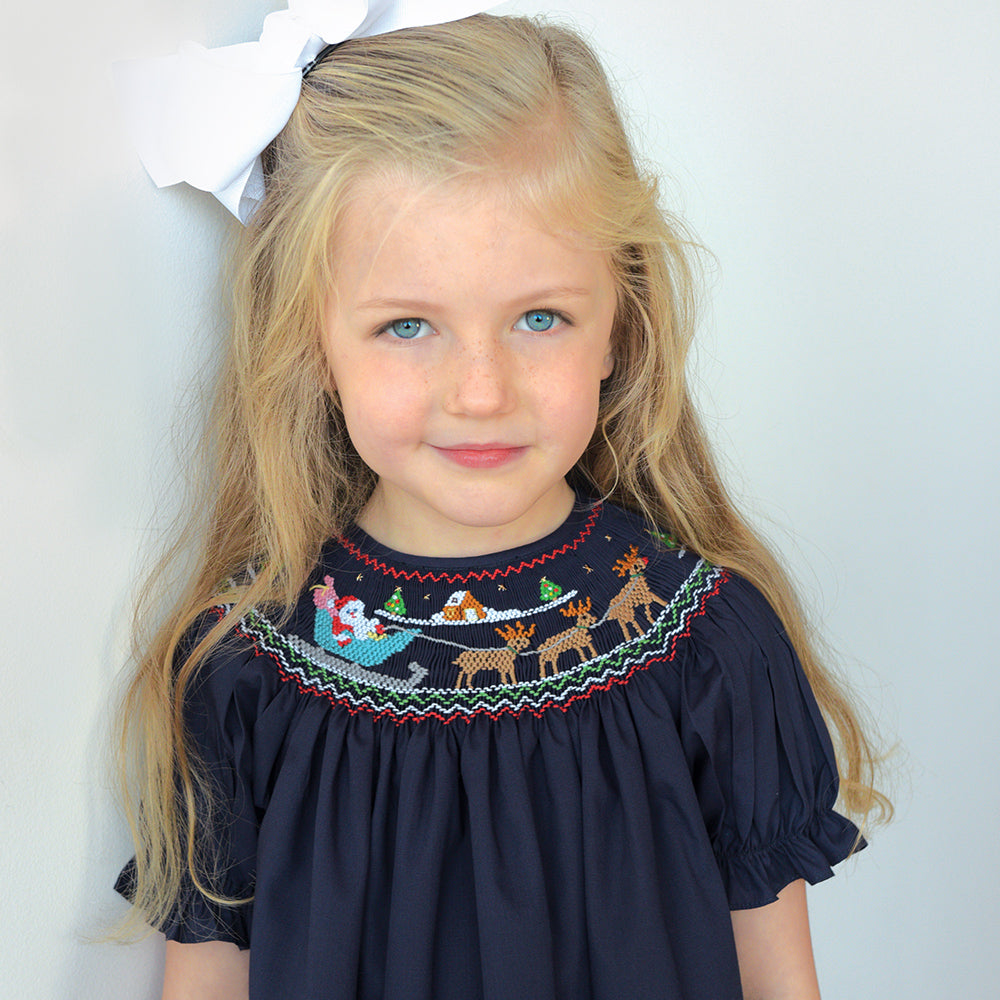 Delivering Santa & Reindeer Navy Blue Smocked Bishop 19H 6601 A